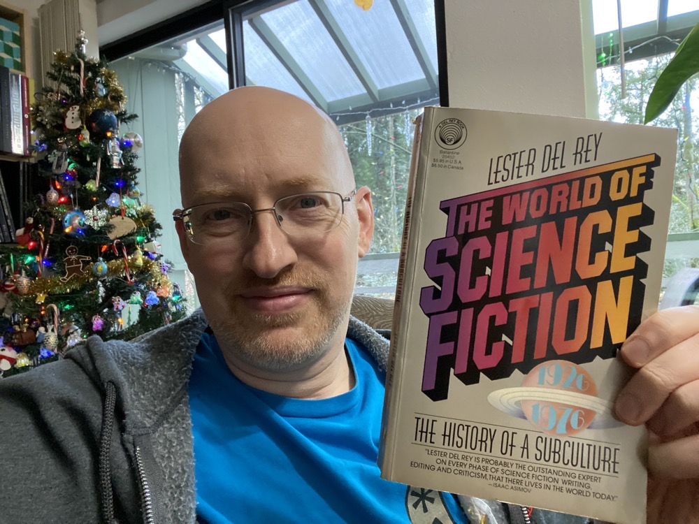 Michael holding The World of Science Fiction