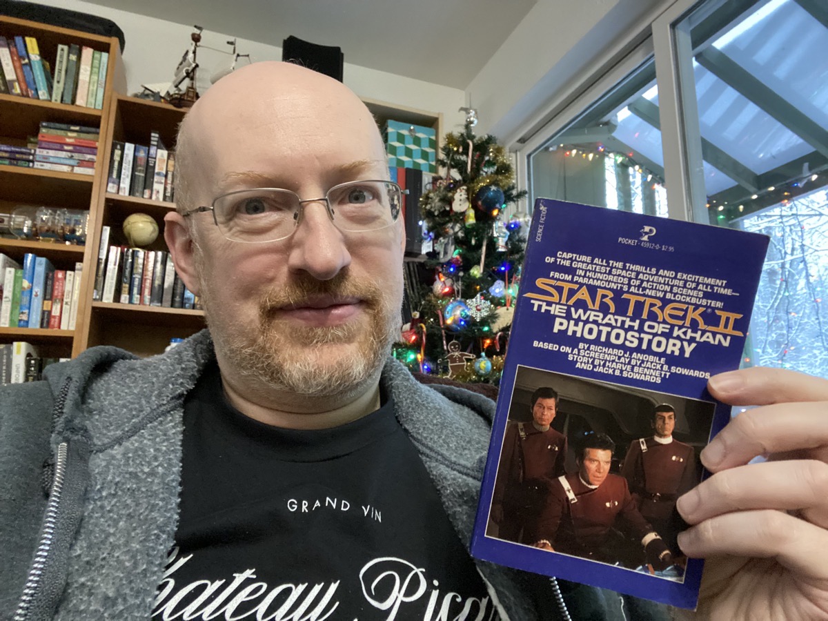 Michael holding the book Star Trek II: The Wrath of Khan Photostory