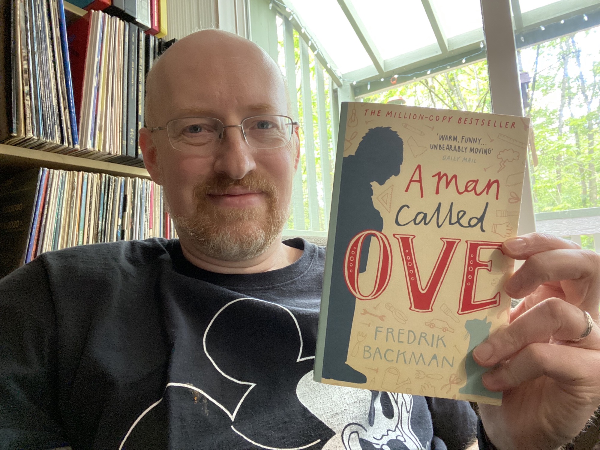 Michael holding A Man Called Ove