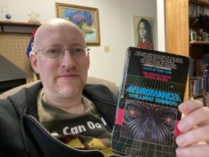 Michael holding Neuromancer