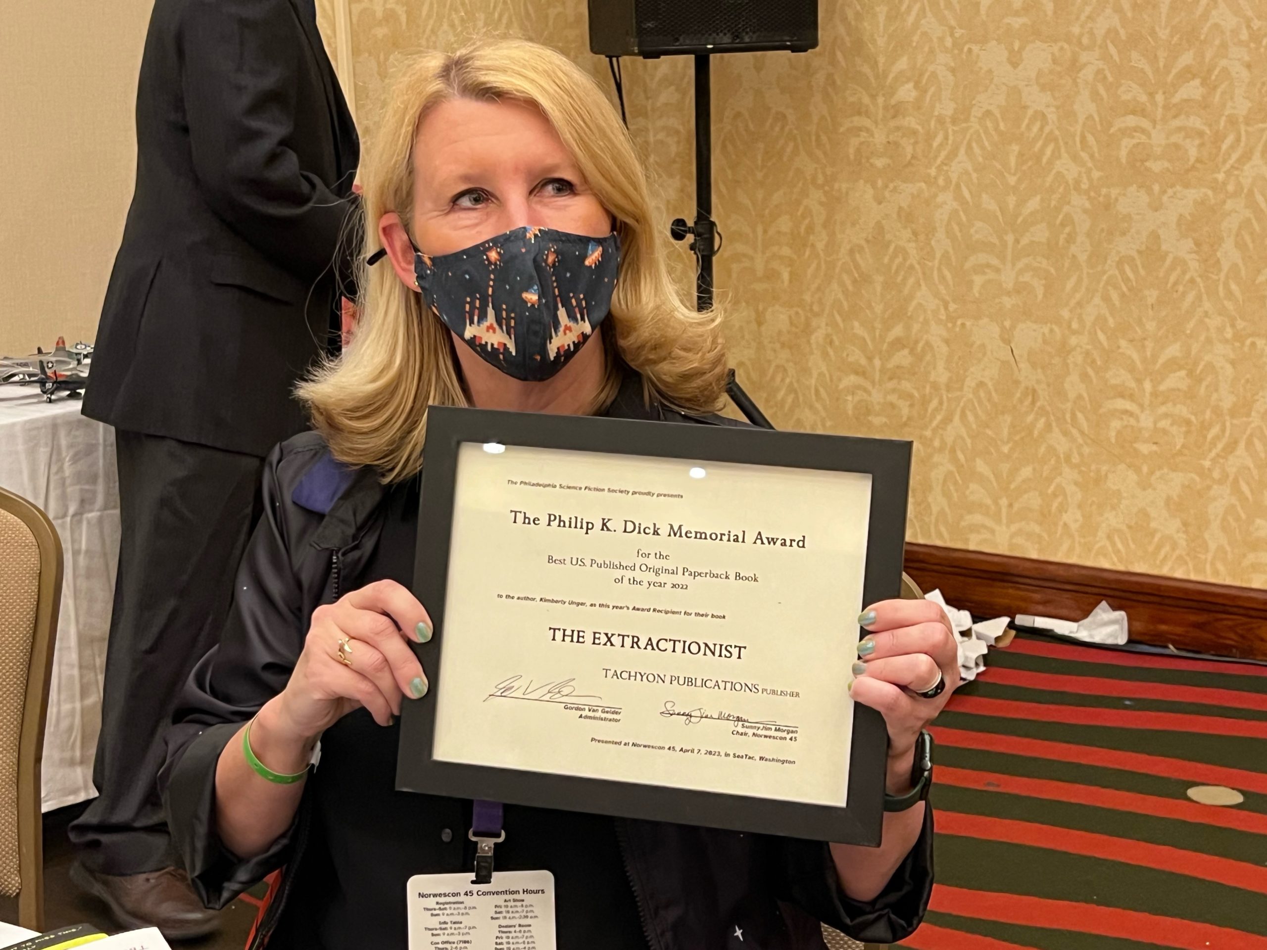 Award winner Kimberly Unger holding her award certificate.