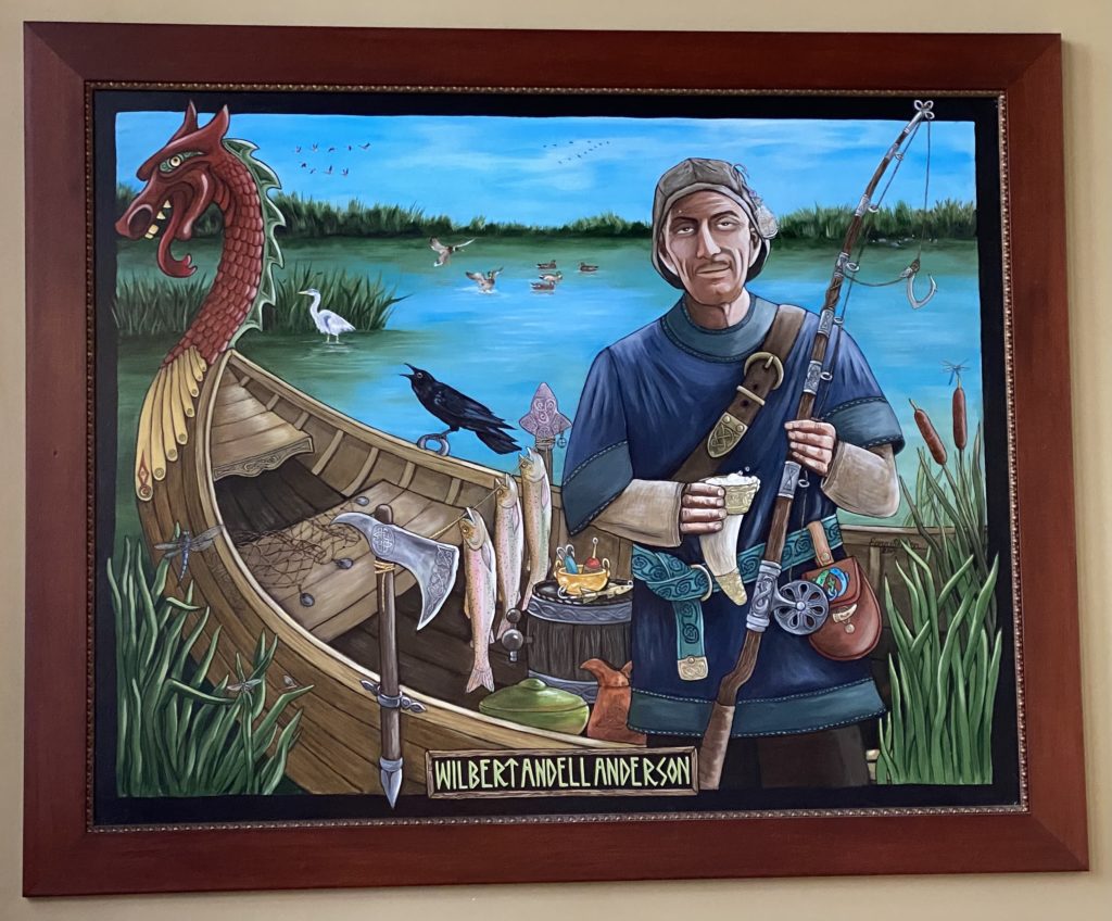 The full painting of Wilbert Andell Anderson, depicted as a creepy-looking gaunt white man with a brown goatee wearing a blue t-shirt and backwards baseball cap and holding a fishing rod; his eyes are hooded and he has a slight smirk, as if he’s sizing you up and deciding he could easily dispose of you where you wouldn’t be found anytime soon. He is standing in front of a canoe with a Viking-style dragon prow; an axe with Nordic etchings is attached to the boat, and there is a shield in the bottom of the boat next to the fish that have been caught. Wilber is holding a horn of mead, and has several belts with more Nordic designs wrapped around him. He looks like a backwoods redneck badly cosplaying his just-discovered Viking ancestry.