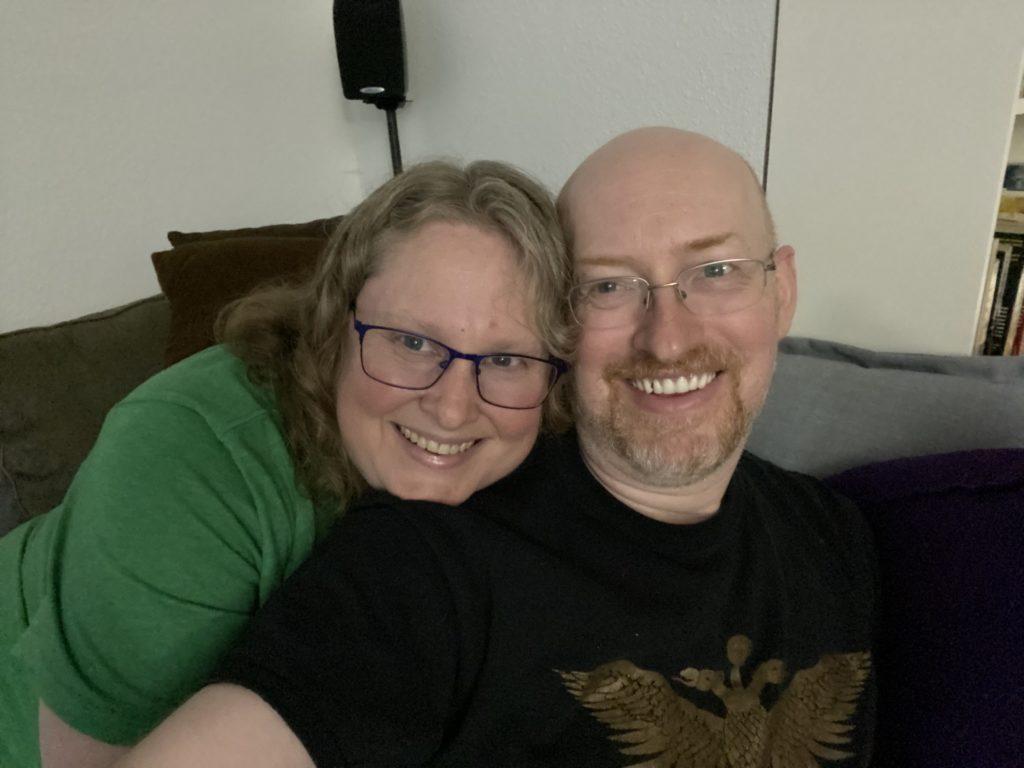 My wife and I cuddled up on a couch.