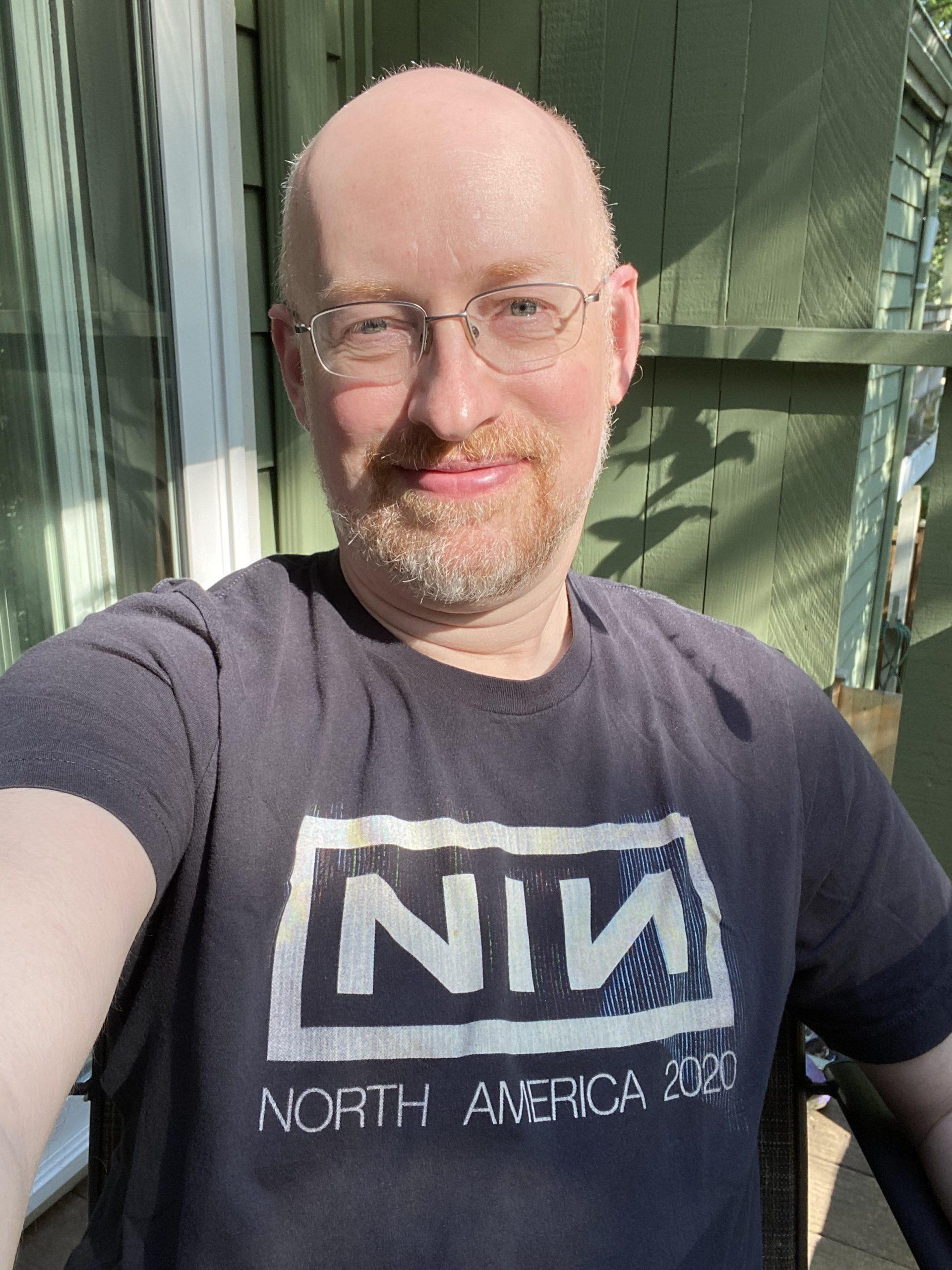 Me wearing a Nine Inch Nails 2020 tour t-shirt