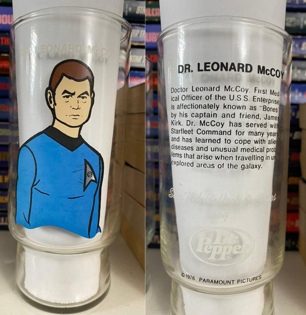 A photocollage of the front and back of the McCoy glass, with a piece of white paper placed inside the glass to make the artwork easier to view.