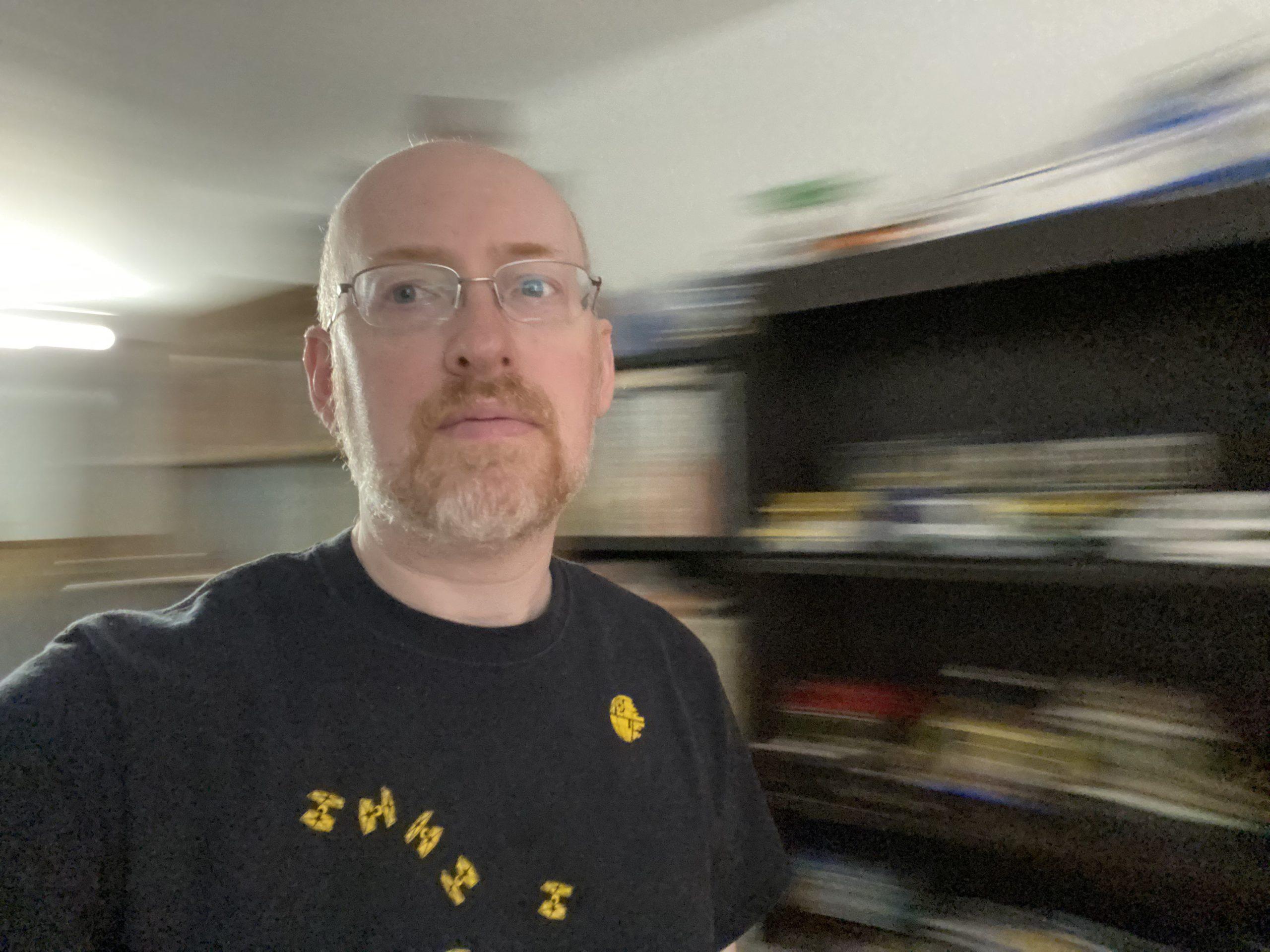 Me in the middle of a room, with the background motion blurred as I spin around.