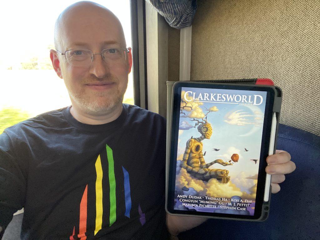 Me holding my iPad with Clarkesworld Issue 203