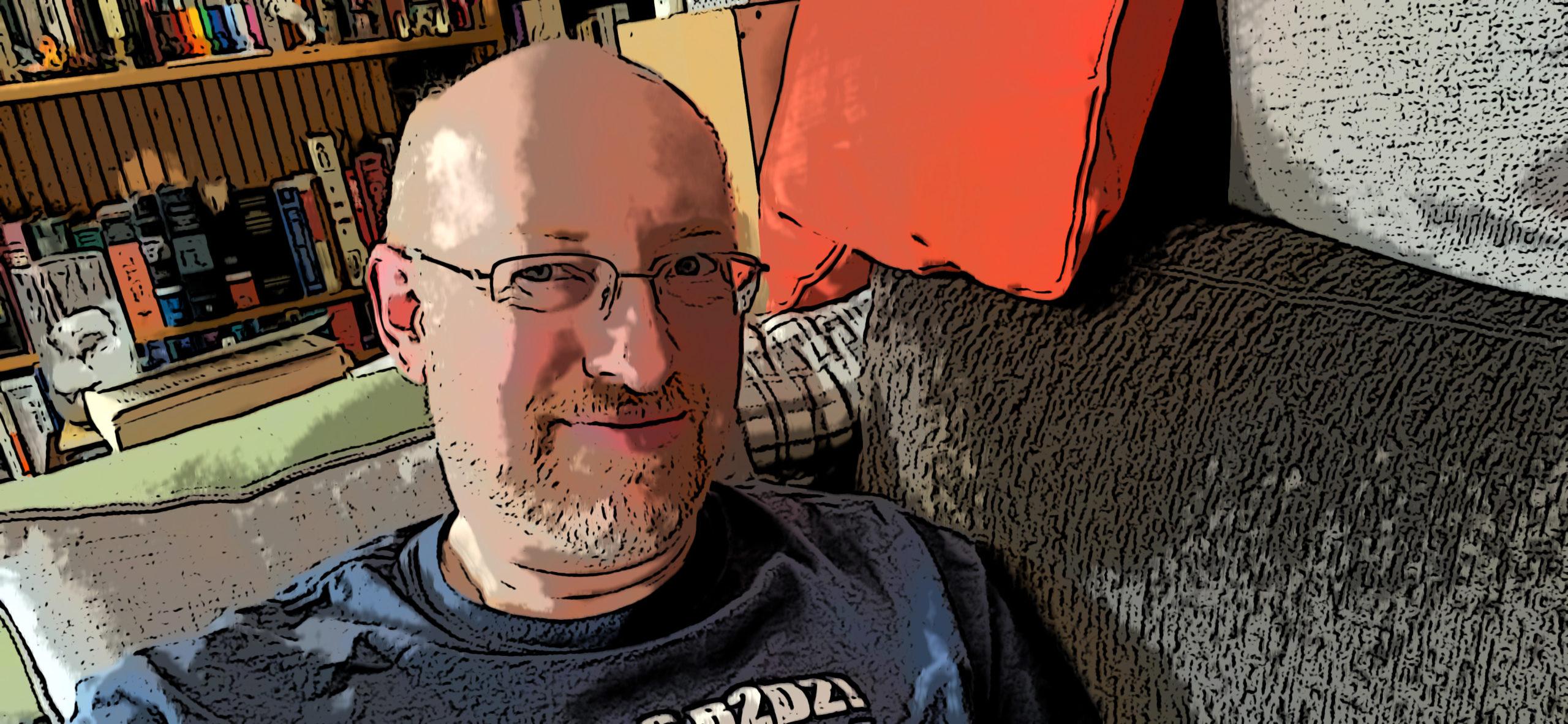 Me sitting on a grey couch, processed to look like comic book artwork.