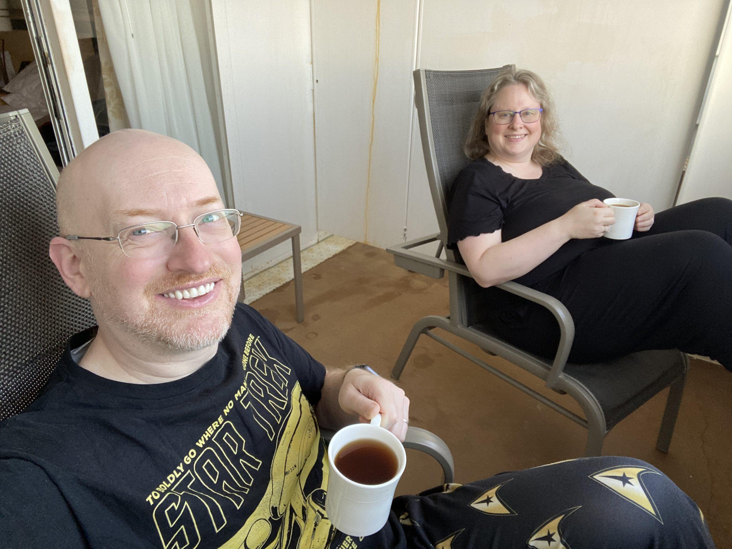 My wife and I in deck chairs on our stateroom balcony, wearing comfy jammies, holding mugs of warm drinks.