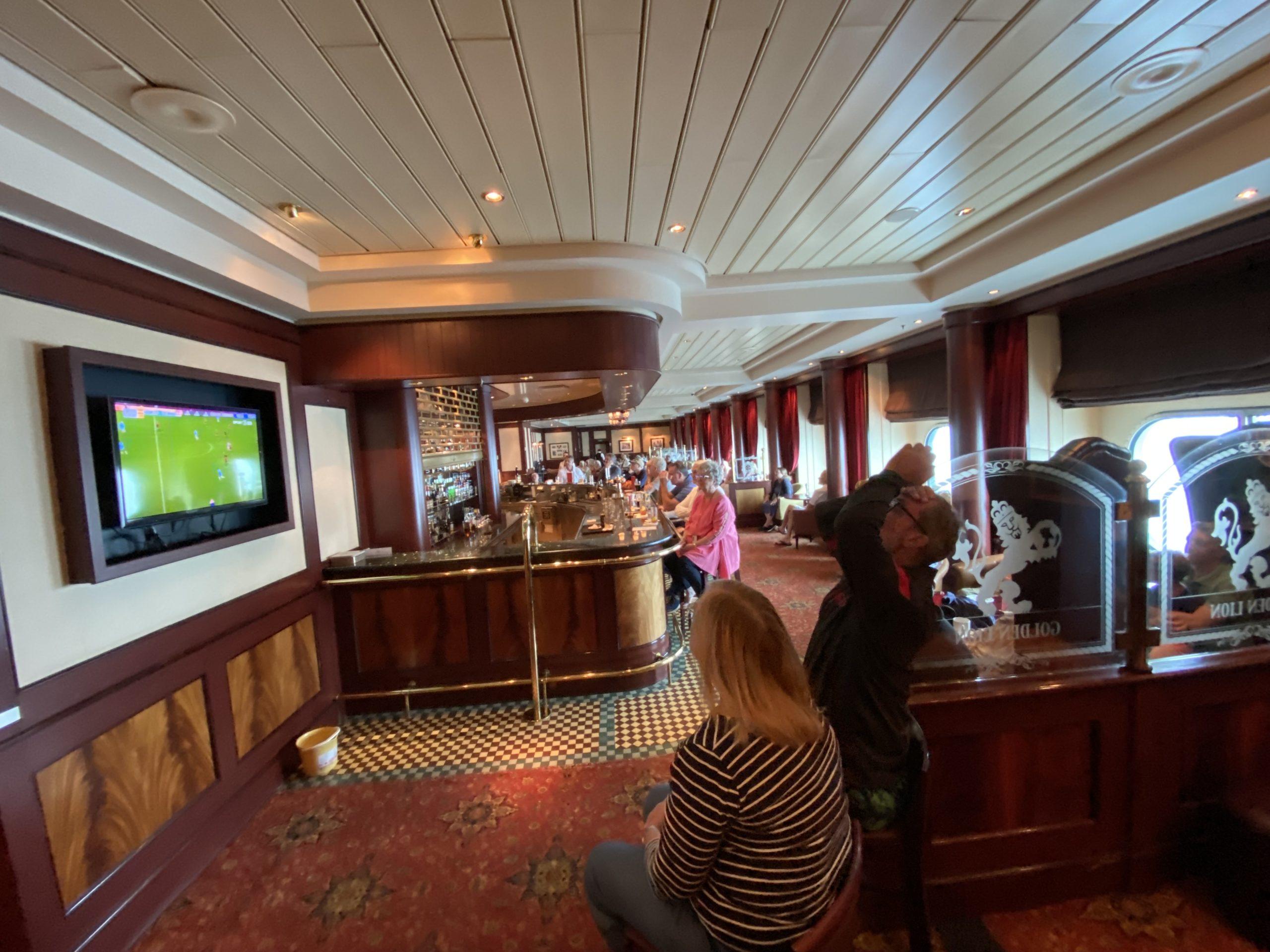 Viewers react to England's World Cup loss in the shipboard pub.