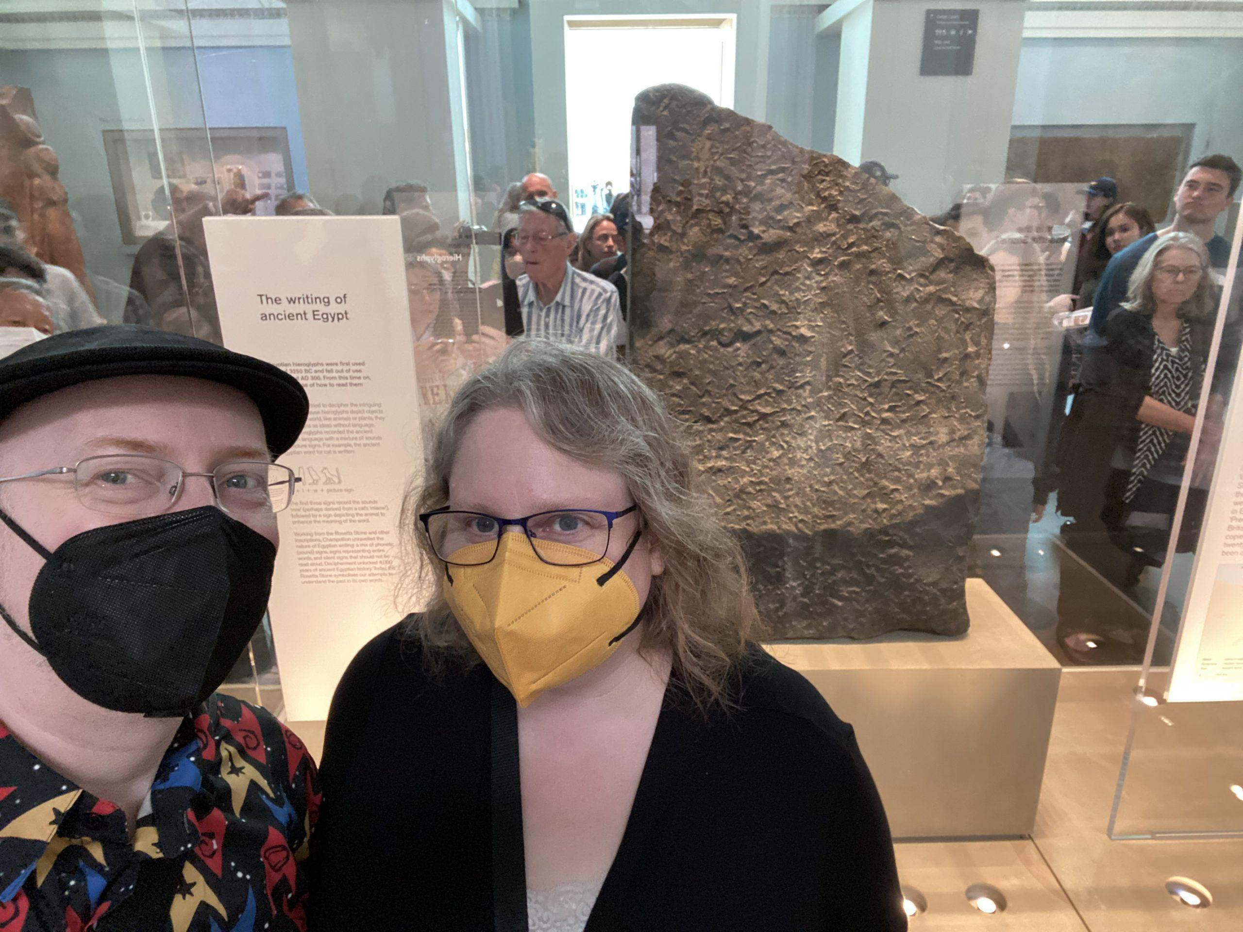 My wife and I at the British Museum in front of the back (unetched) side of the Rosetta Stone.