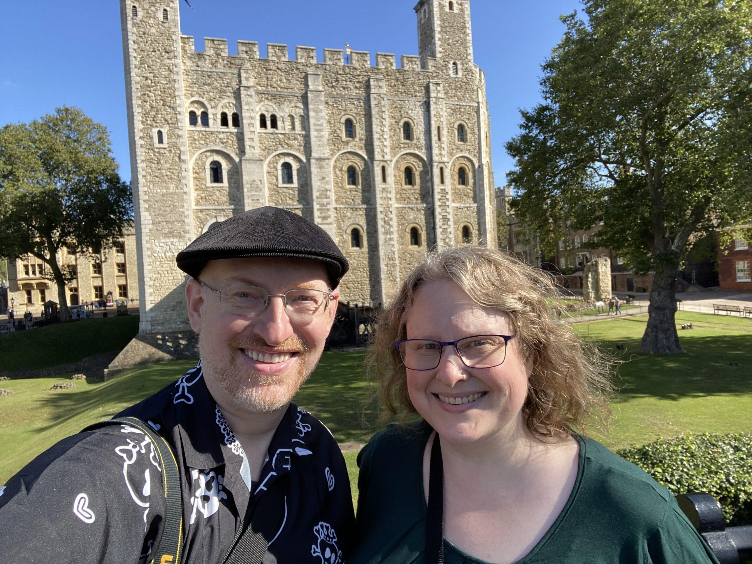 My wife and I at the Tower of London, with the White Tower visible behind us.