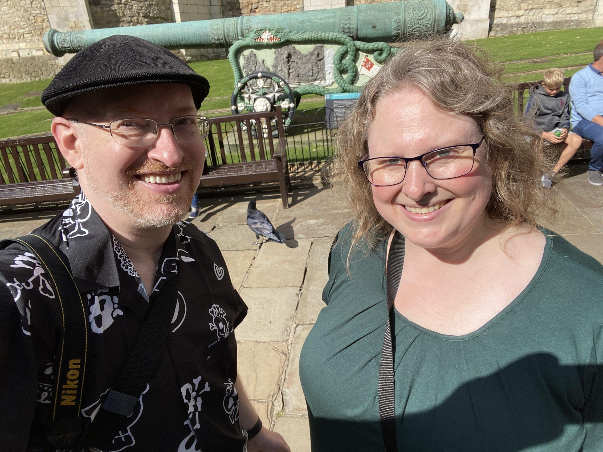 My wife and I at the Tower of London, with one of its famous ravens visible behind us.