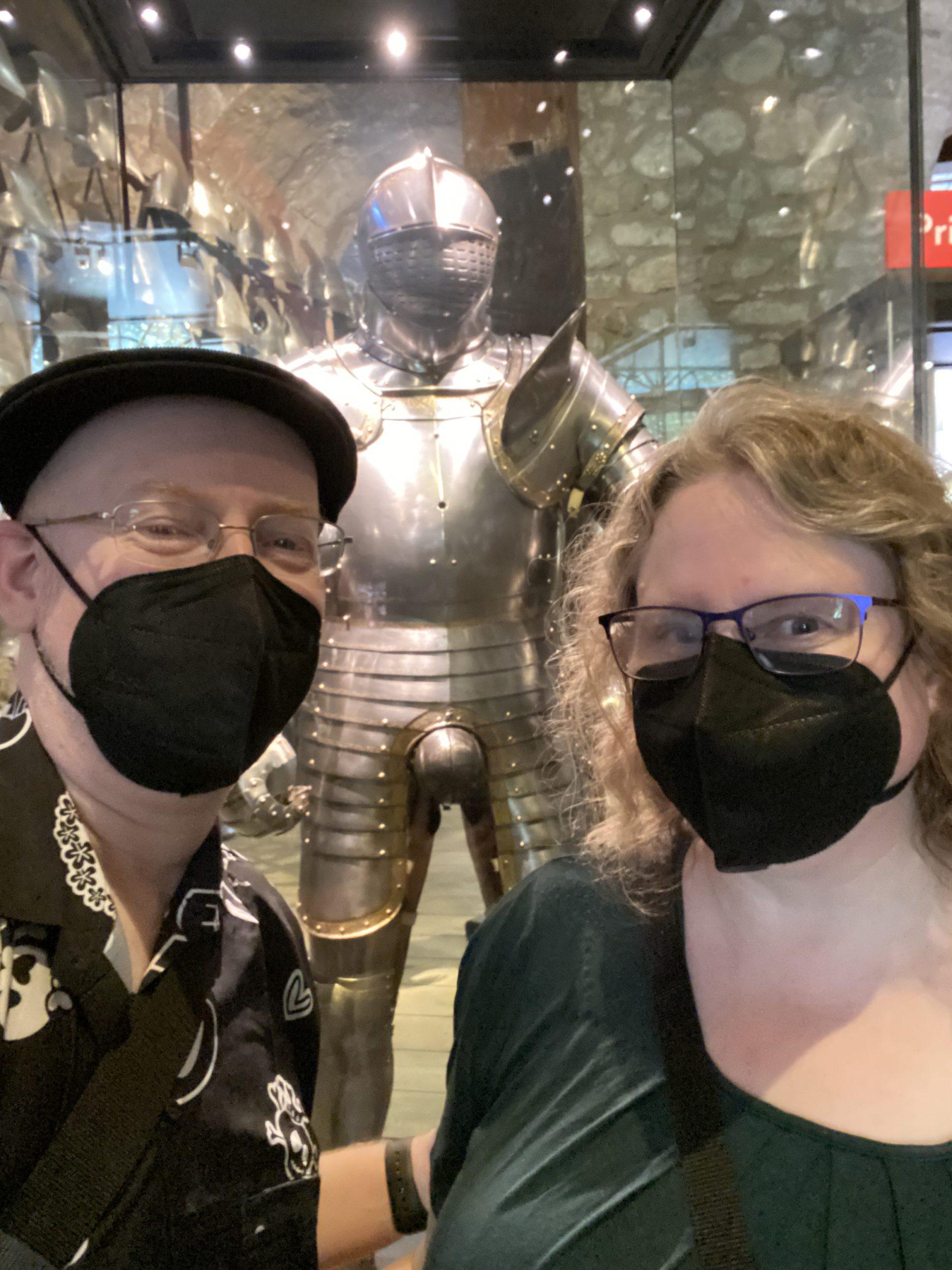 Us in front of one of King Henry VIII's suits of armor; this one has a very noticeable codpiece.