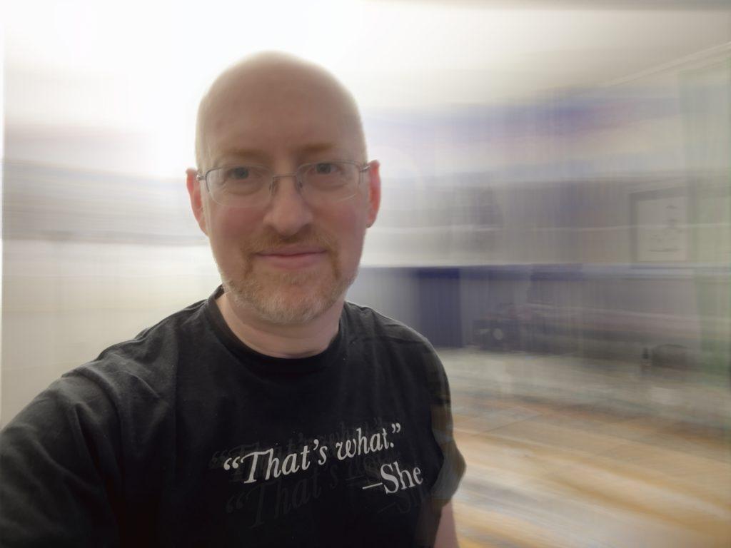 Me against a horizontally motion blurred background, as if I was spinning in circles (which I was).