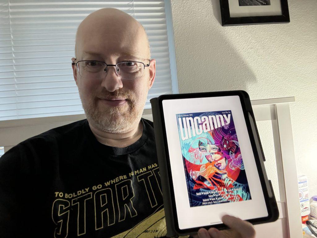Me holding Uncanny Issue 56 on my iPad