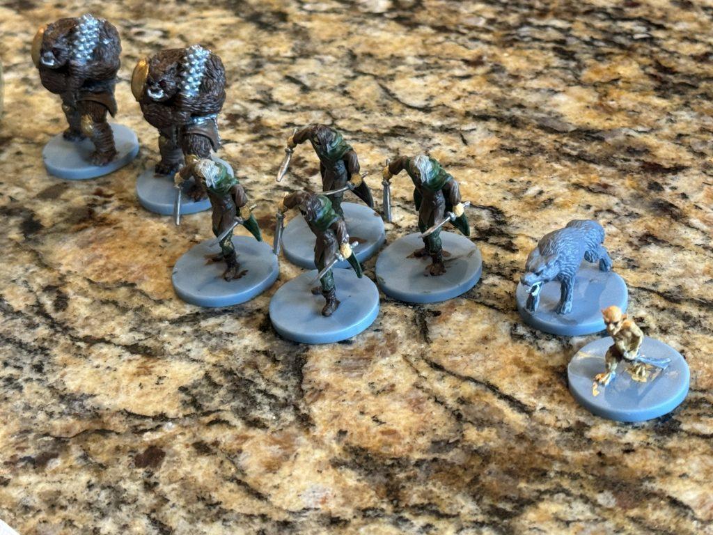 A lineup of D&D miniatures that have been painted by my nephew.