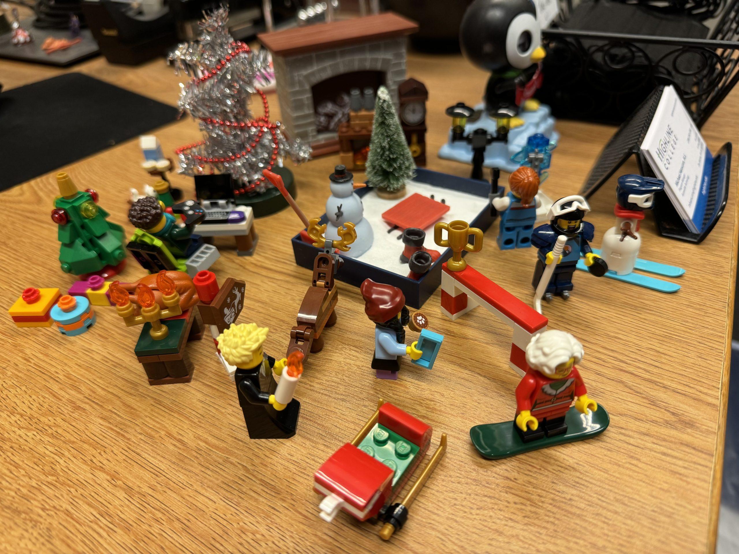 A collection of winter holiday-themed toys on my desk at work.