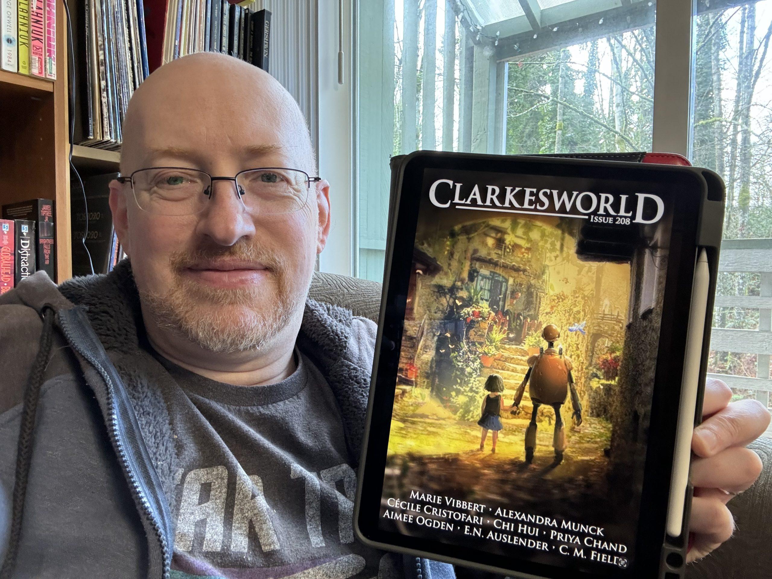 Me holding Clarkesworld 208 on my iPad.