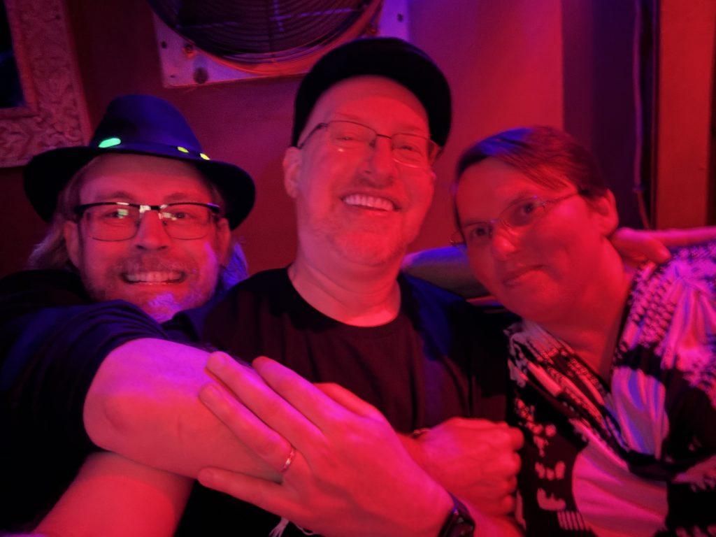 Alan, me, and Kathy in the club, lit all in red.