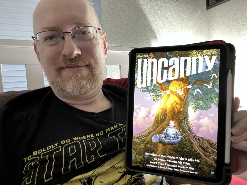 Me holding Uncanny 57 on my iPad