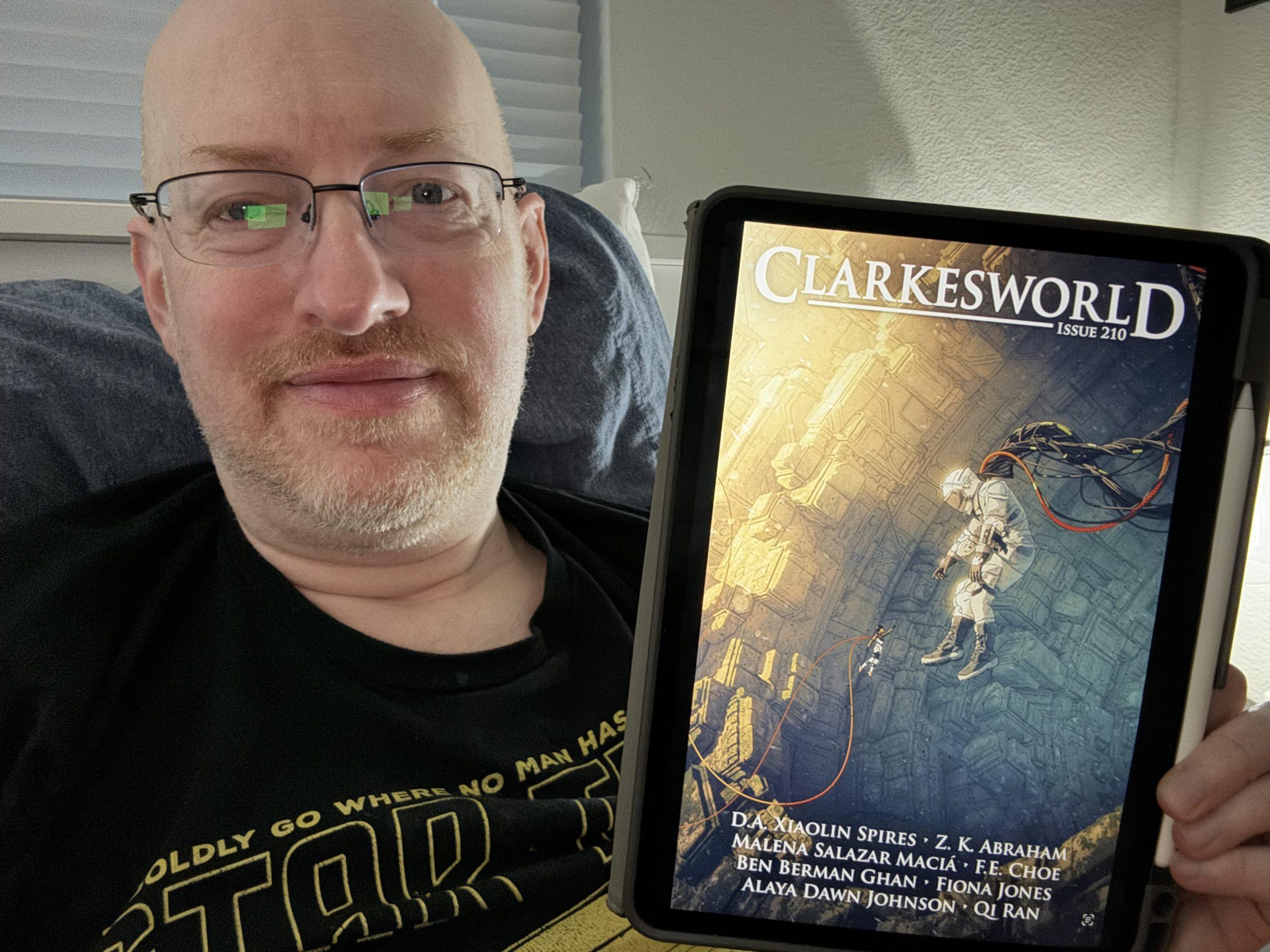 Me holding Clarkesworld 210 on my iPad