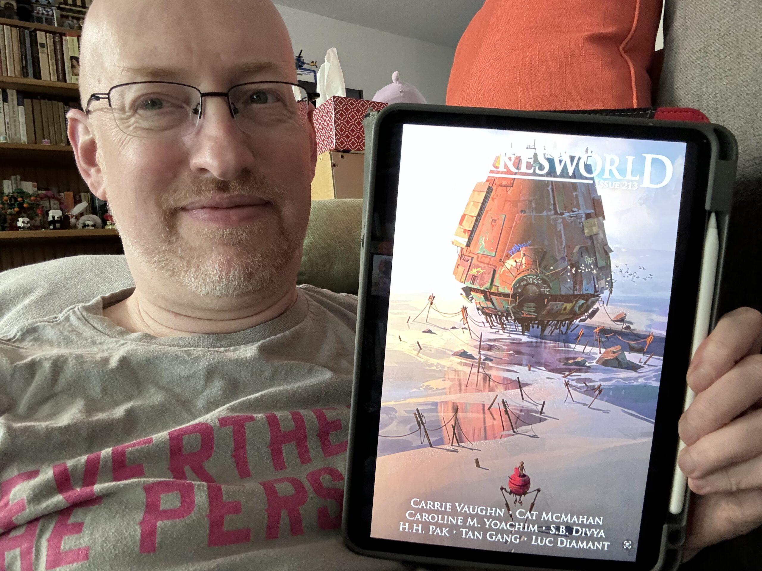 Me holding Clarksworld issue 213 on my iPad