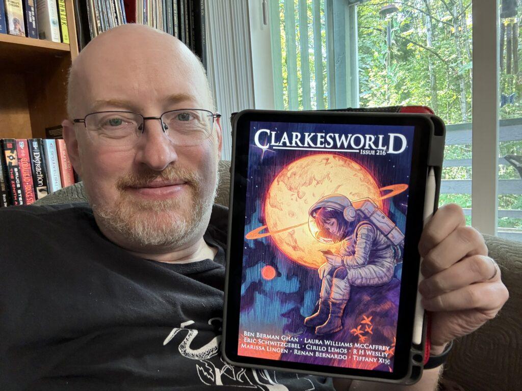 Me holding Clarkesworld 216 on my iPad.