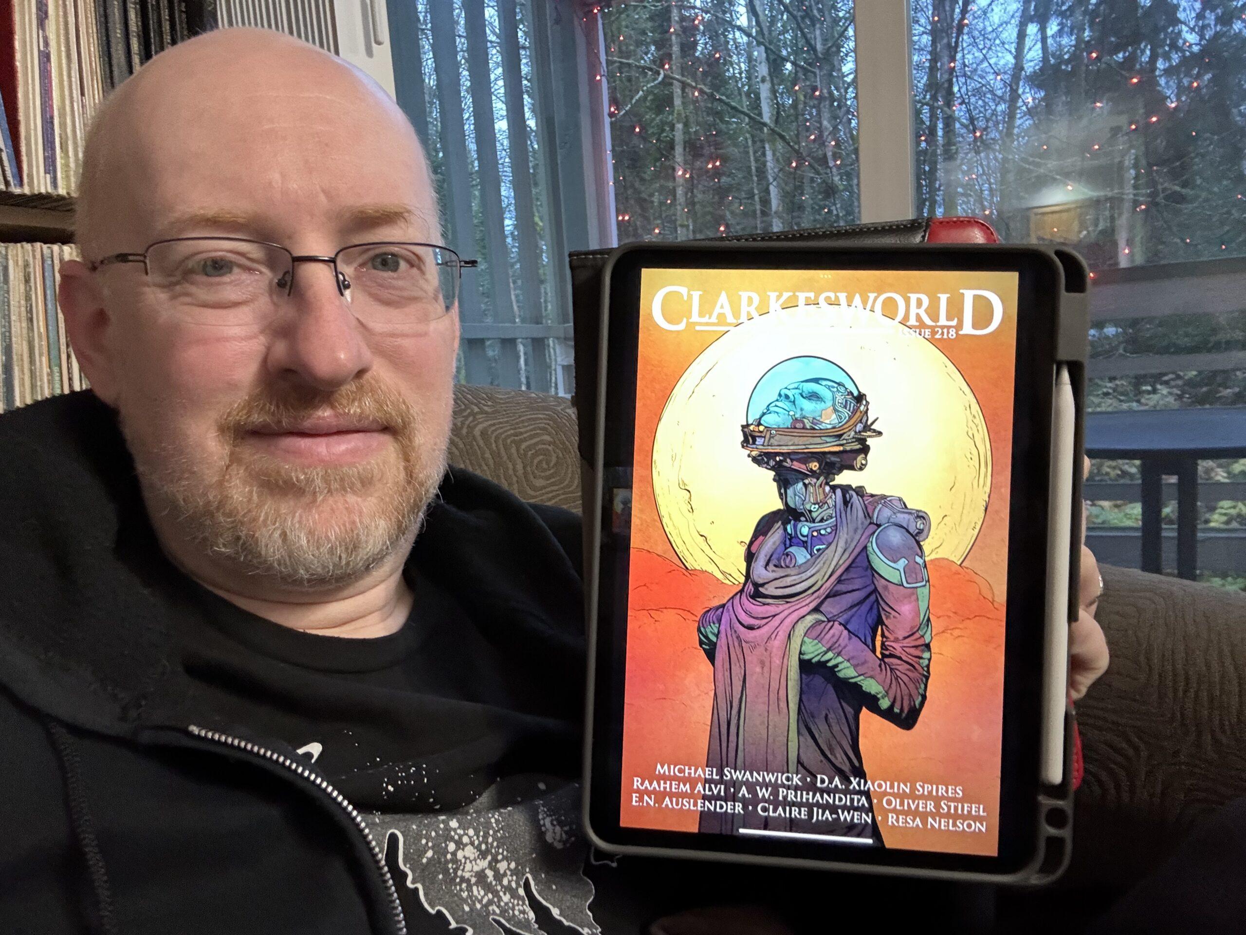 Me holding Clarkesworld 218 on my iPad