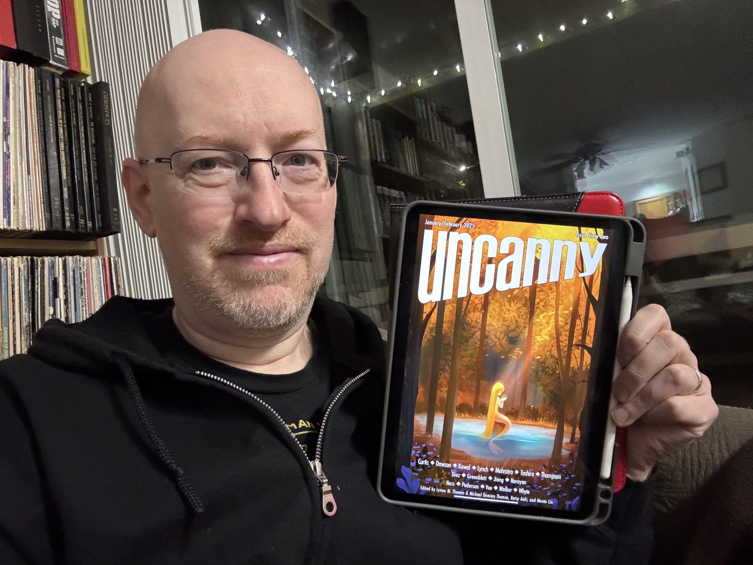 Me holding Uncanny Issue 62 on my iPad