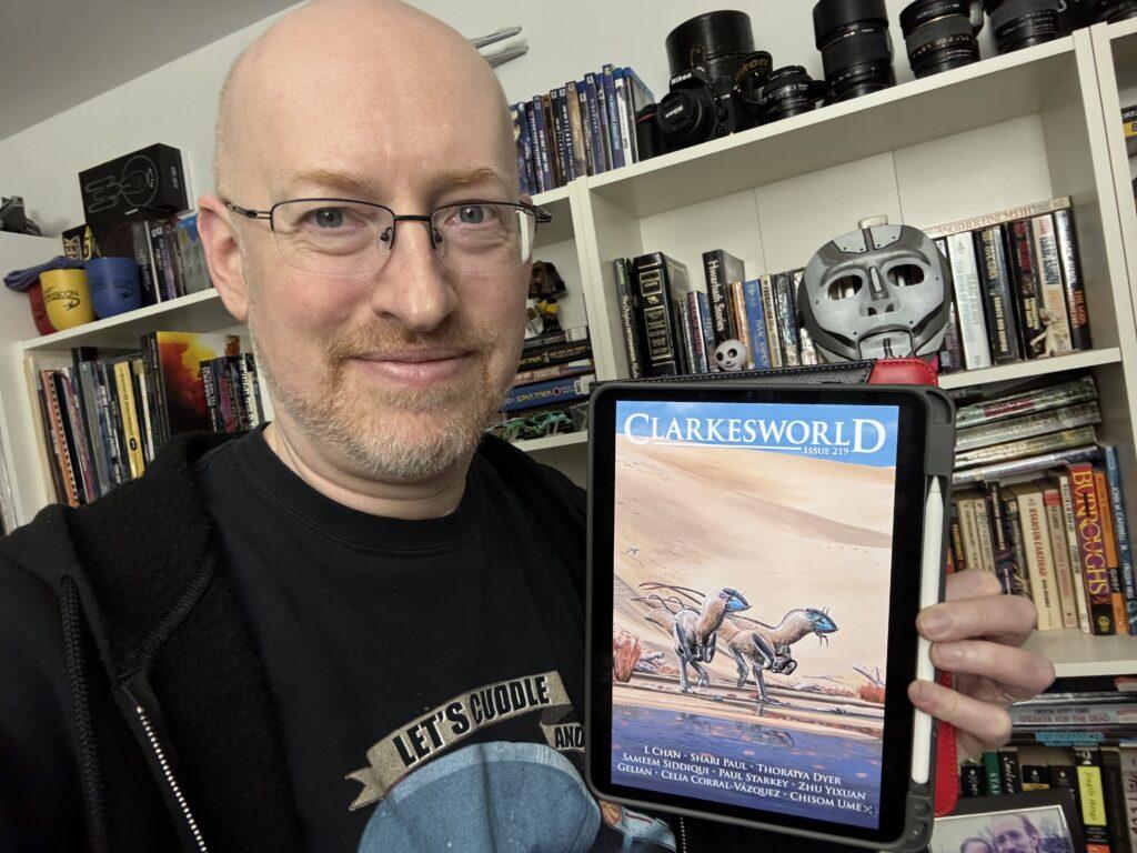 Me holding Clarkesworld 219 on my iPad.