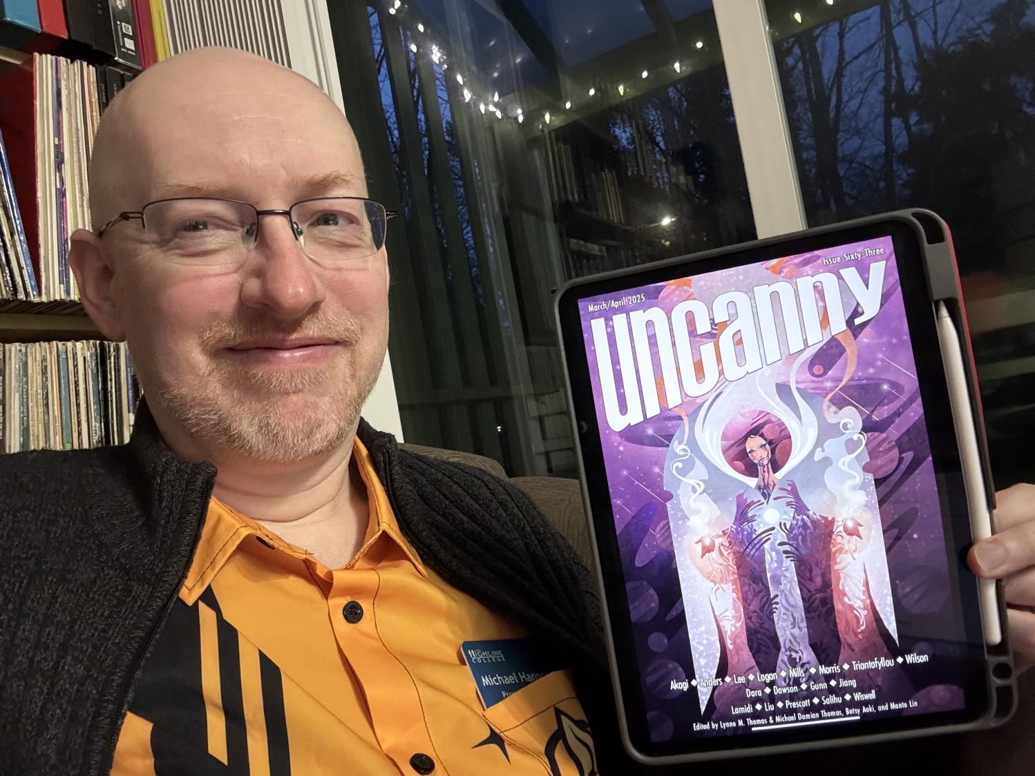 Me holding Uncanny 63 on my iPad