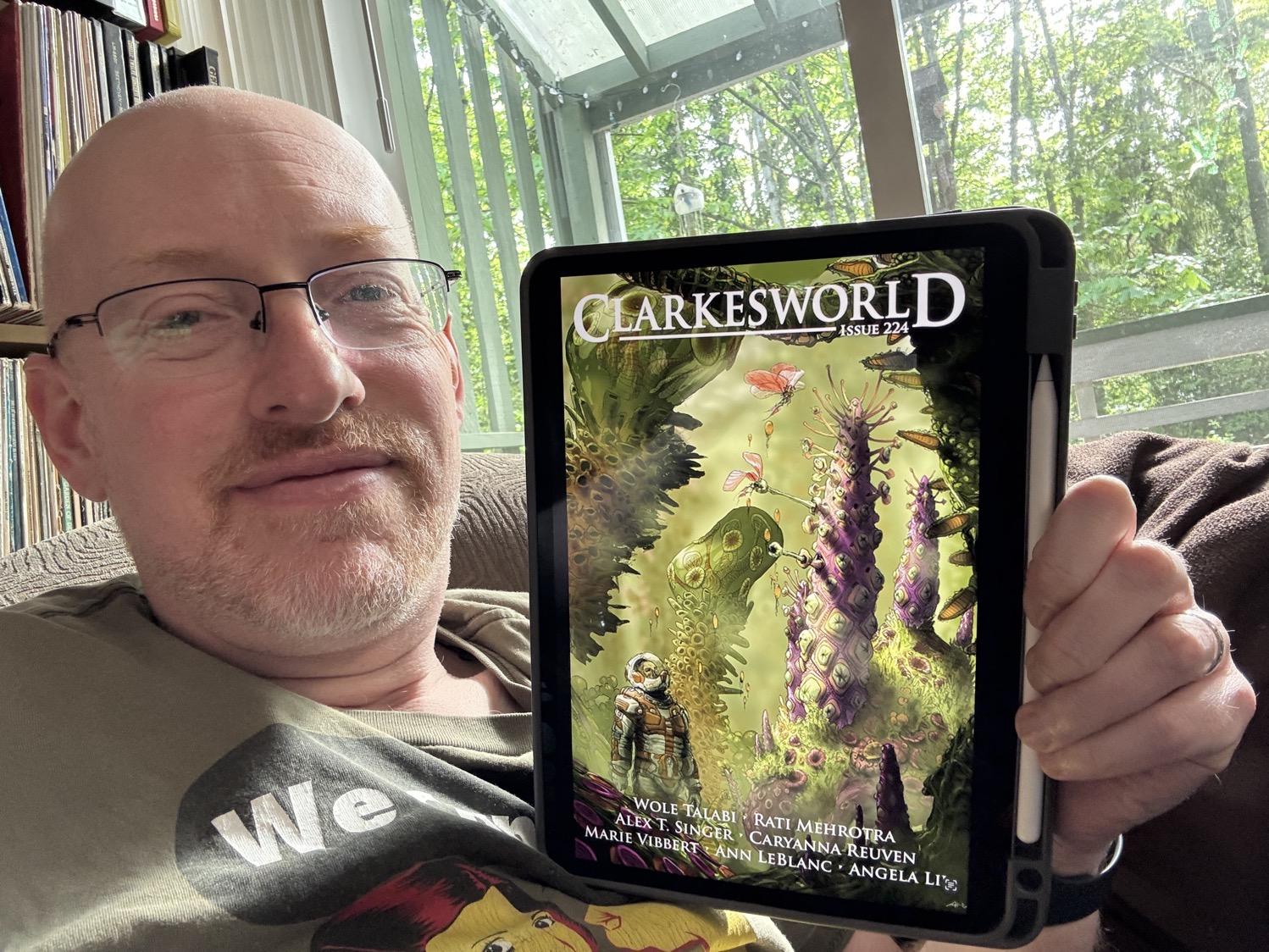 Me holding Clarkesworld 224 on my iPad