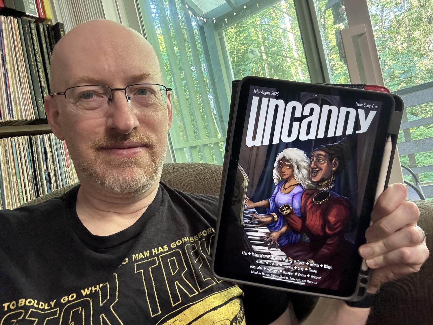 Me holding Uncanny 65 on my iPad