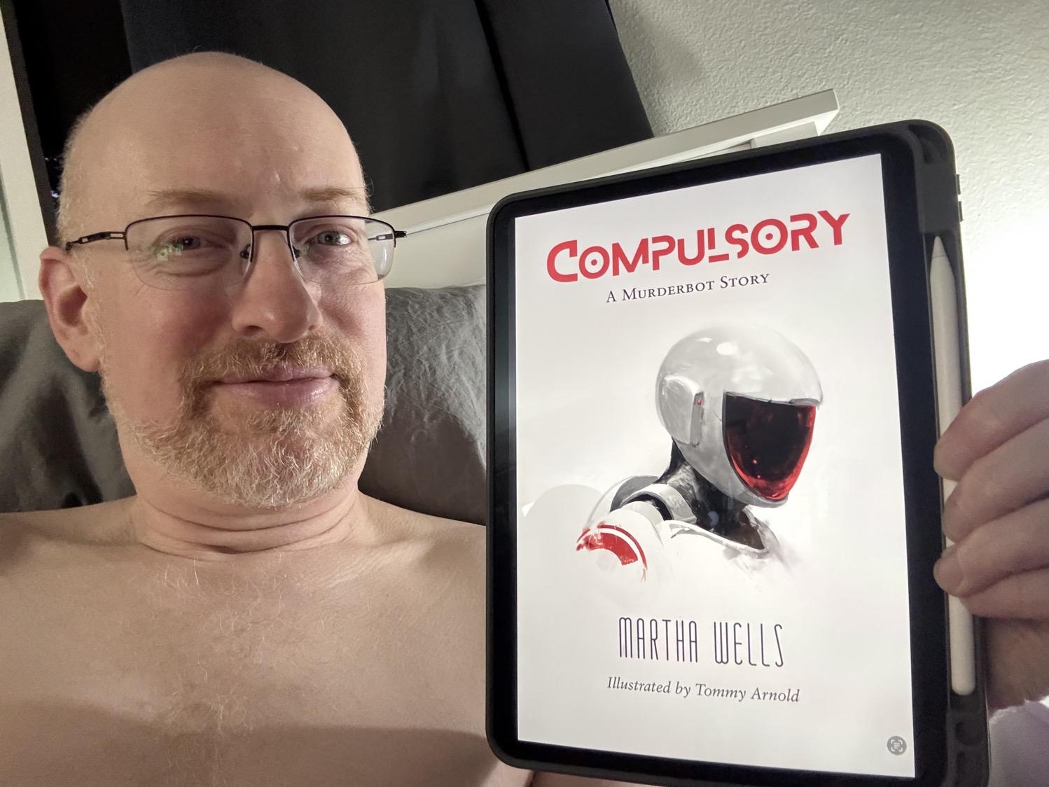 Me holding Compulsory on my iPad