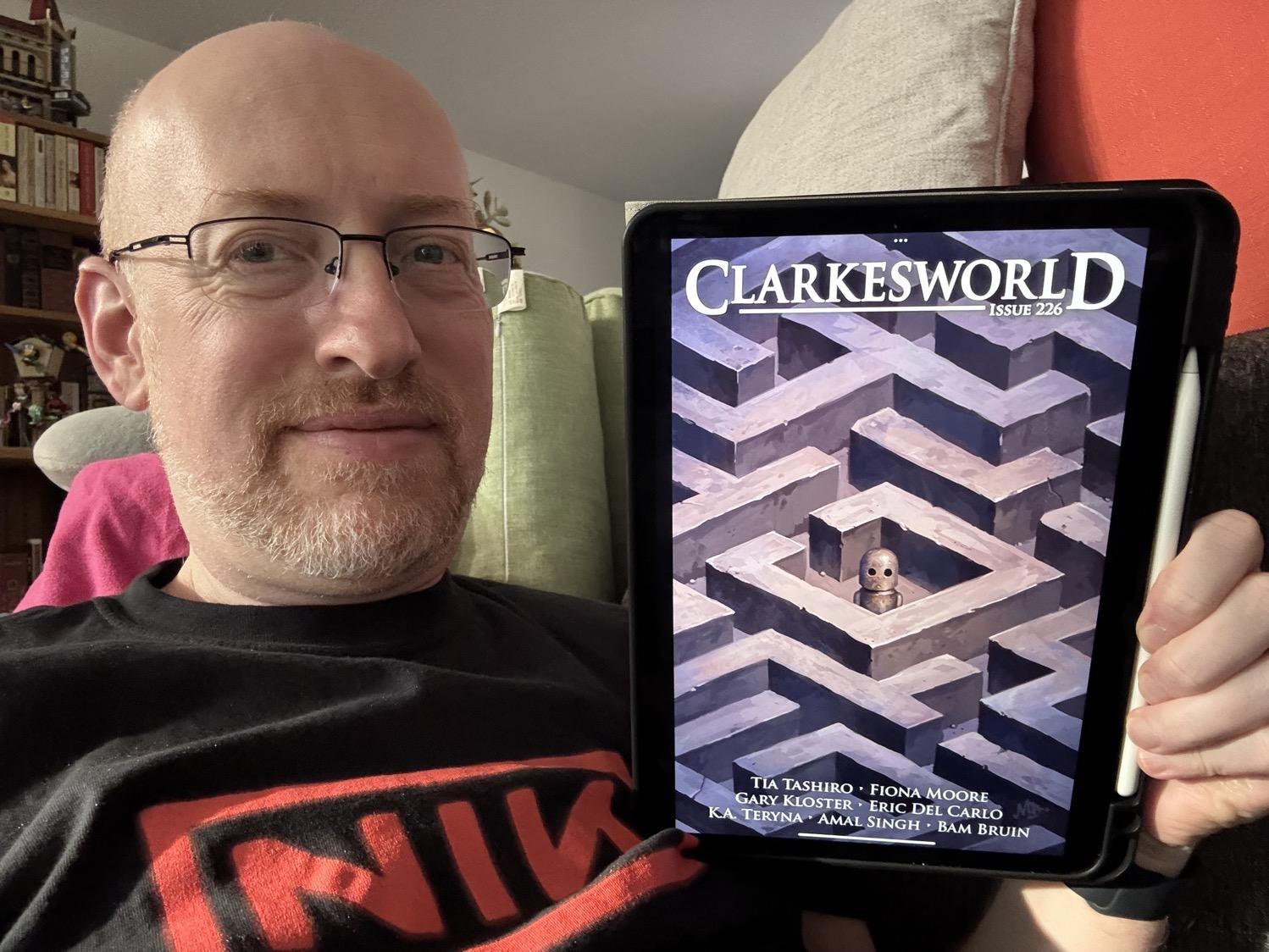 Me holding Clarkesworld 226 on my iPad.