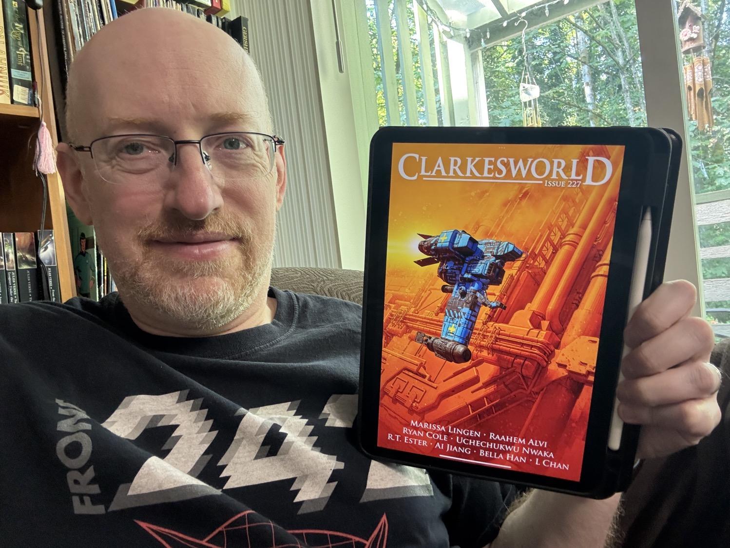 Me holding Clarkesworld issue 227 on my iPad.