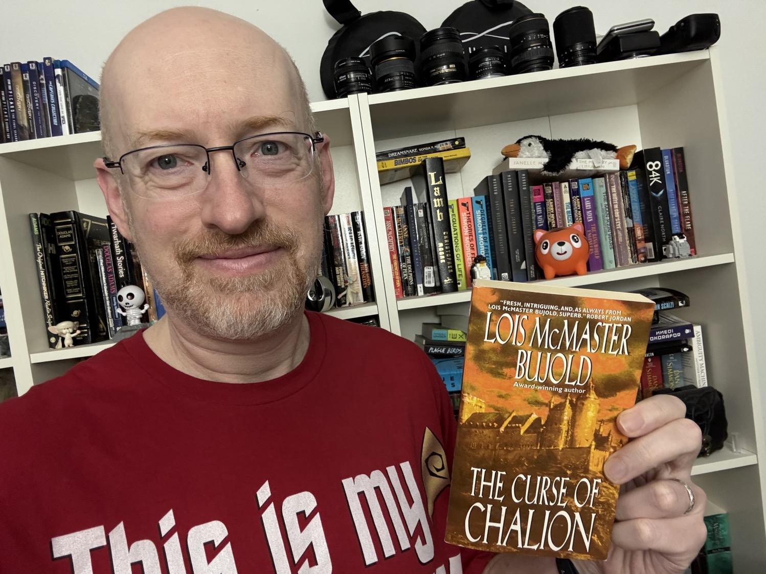 Me holding The Curse of Chalion
