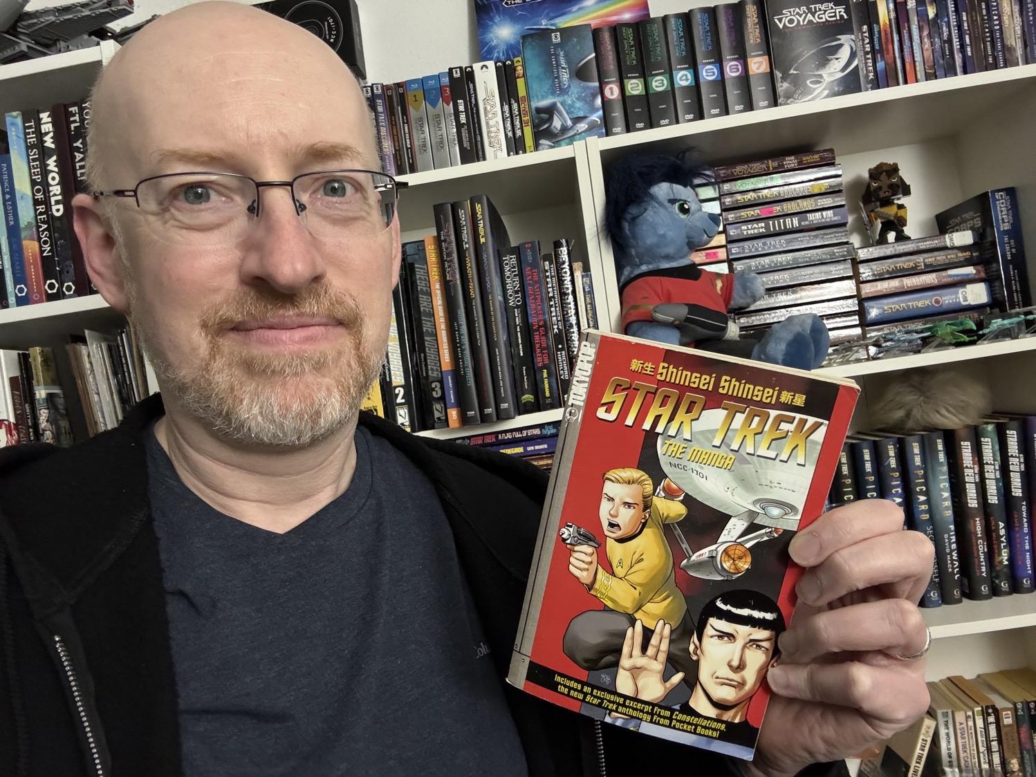 Me holding Star Trek: The Manga Vol. 1