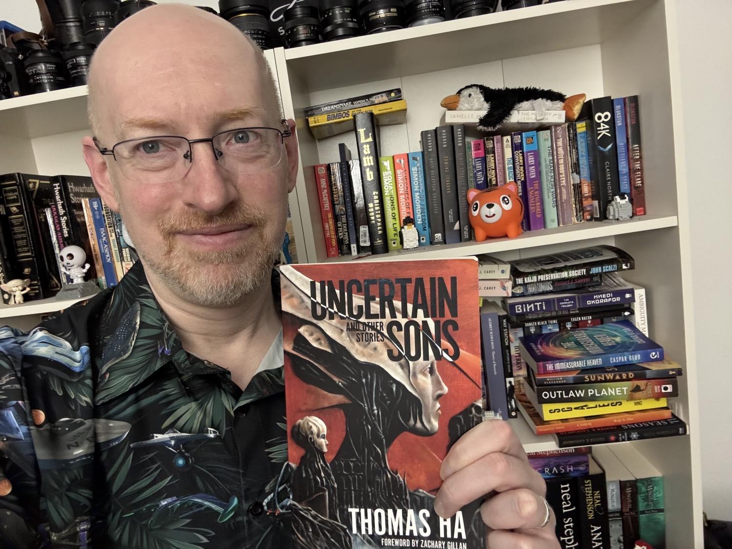 Me holding Uncertain Sons and Other Stories