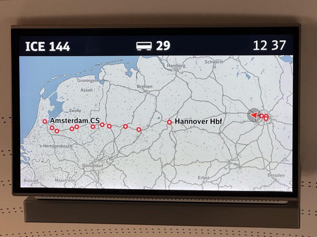 A train monitor display showing a map of our route from Berlin to Amsterdam and the stops along the way.