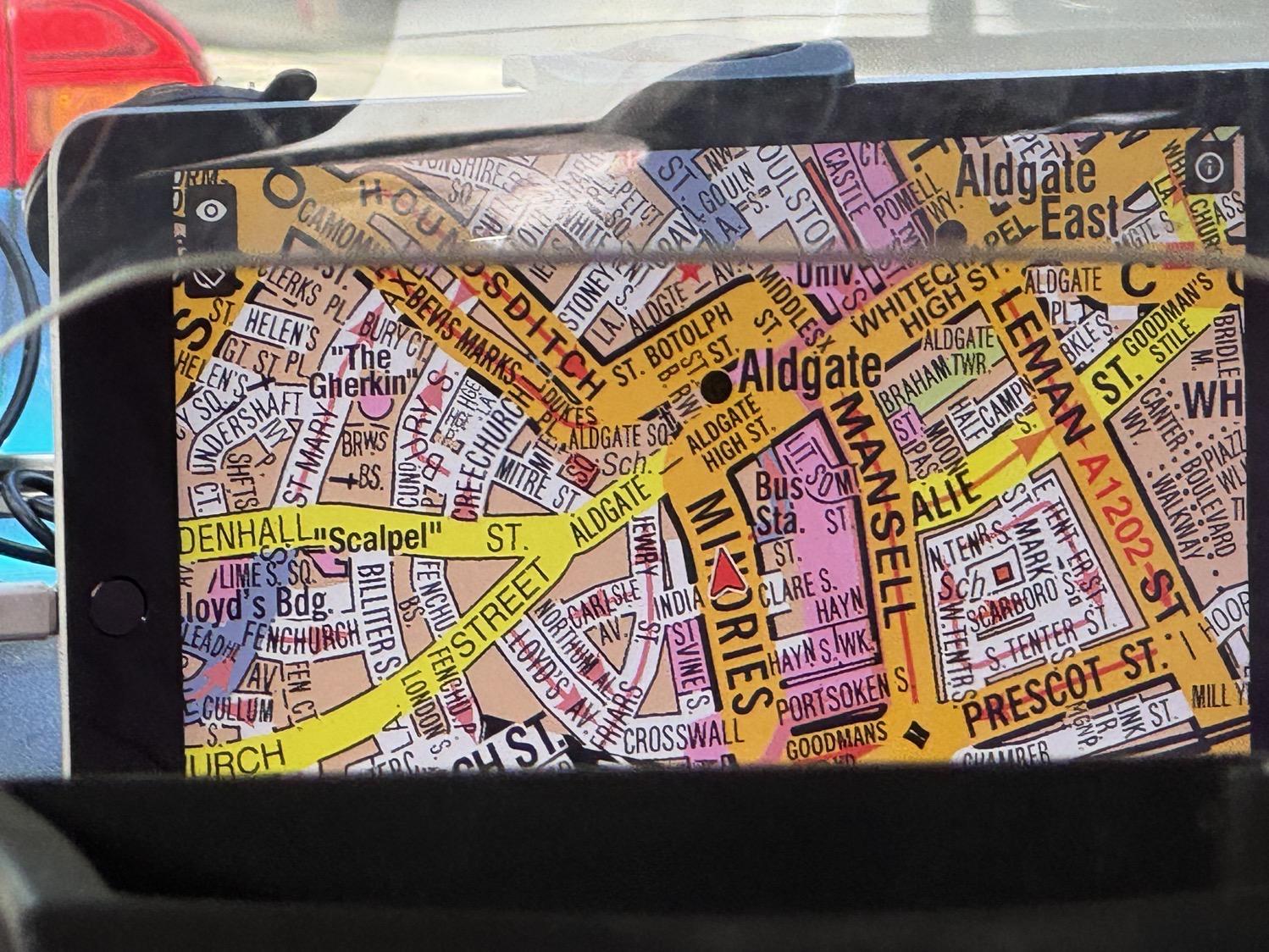 A car video display screen showing a map of London streets in a very busy and visually overwhelming style that probably makes perfect sense if you use it regularly.